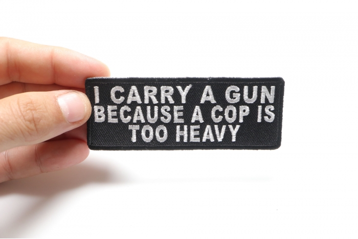 I Carry A Gun Because A Cop Is Too Heavy Patch shown on hand for size comparison