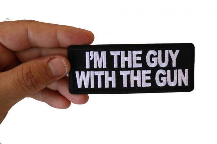 I'm The Guy with the Gun Patch, Funny Saying Patches, Sew or Iron on Patch shown on hand for size comparison