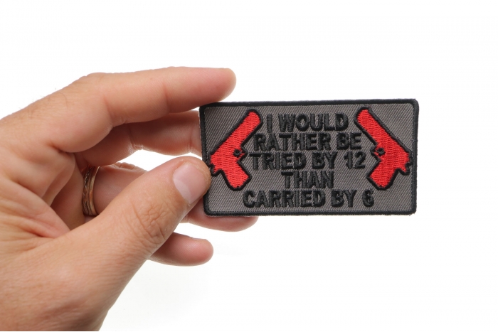 I Would Rather Be Tried By 12 Than Carried By 6 Patch shown on hand for size comparison