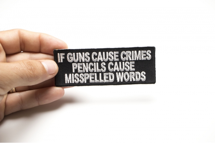 If Guns Cause Crimes Pencils Cause Misspelled Words Patch shown on hand for size comparison