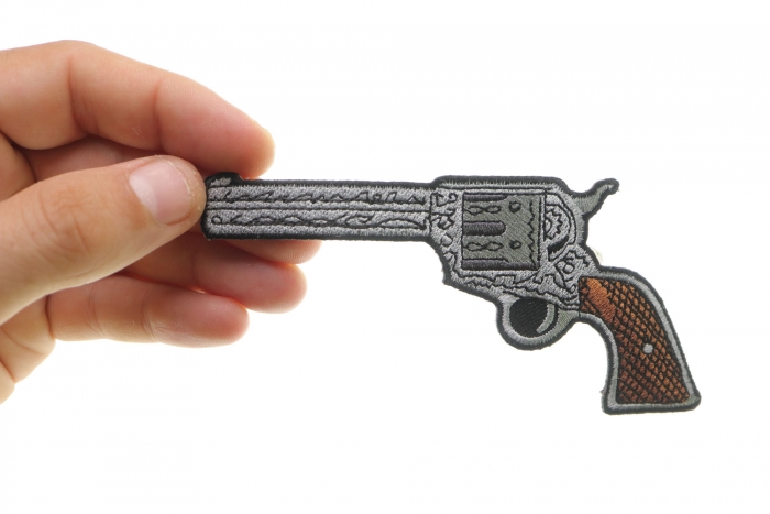 6 Shooter Pistol Patch Left Patch shown on hand for size comparison