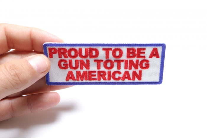 Proud To Be A Gun Toting American Patch, Saying Patches shown on hand for size comparison