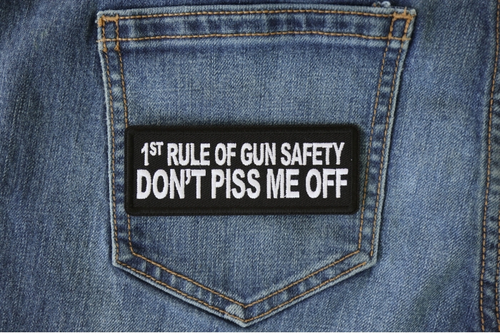 1st Rule of Gun Safety Don't Piss Me Off Patch shown on jeans