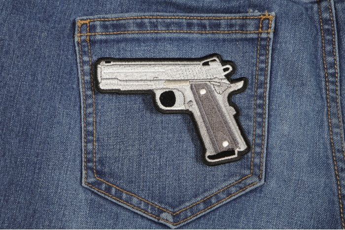 9 Mm Gun Patch shown on jeans
