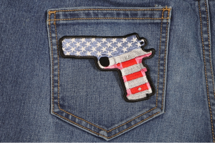 9 Mm Gun With US Flag Patch shown on jeans