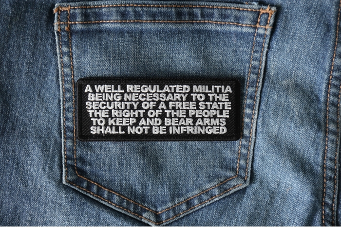 A Well Regulated Militia Being Necessary to the Security of a Free State The Right of The People to Keep and Bear Arms Shall not Be Infringed 2nd Amendment Oath Patch shown on jeans