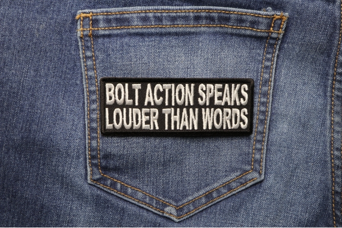 Bolt Action Speaks Louder Than Words Patch shown on jeans
