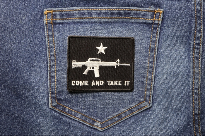 Come and Take It Star Machine Gun Patch shown on jeans
