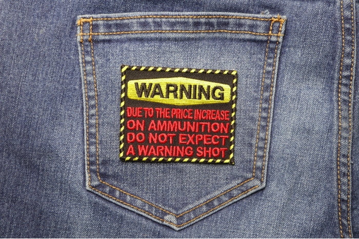 Warning Due To the Price Increase on Ammunition Do Not Expect Warning Shot Patch shown on jeans
