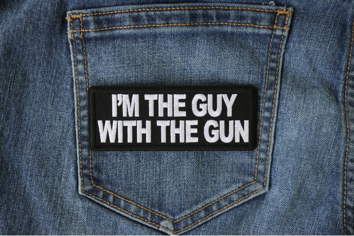 I'm The Guy with the Gun Patch shown on jeans