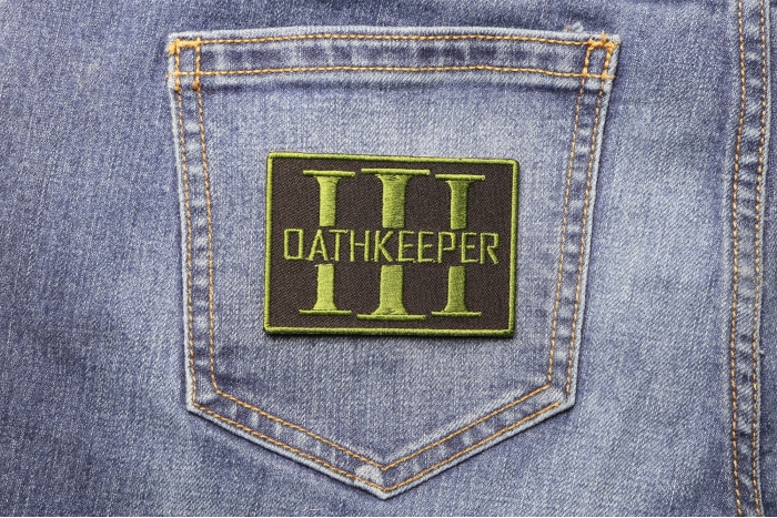 Oathkeeper Three  Percenter OD Green Patch shown on jeans