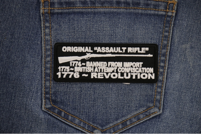 Original Assault Rifle, 1774 Banned from Import, 1775 British Attempt Confiscation, 1776 Revolution Patch shown on jeans