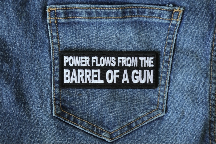 Power Flows From the Barrel of a Gun Funny Iron on Patch shown on jeans