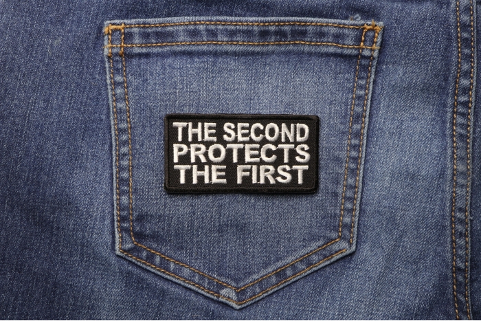 The Second Protects The First Patch shown on jeans