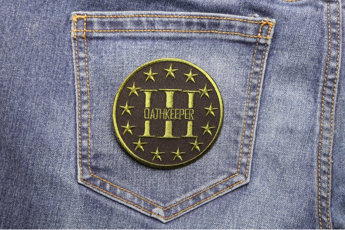 Three Percenter Oathkeeper Round Patch Green shown on jeans