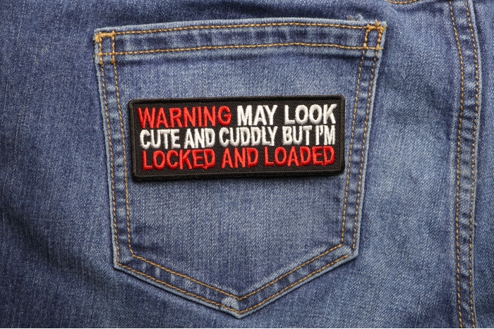 Warning May Look Cute and Cuddle But I'm Locked and Loaded Patch shown on jeans