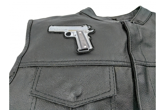 9 Mm Gun Patch - 4x3 inch shown on leather vest