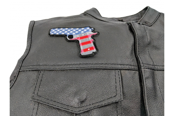9 Mm Gun with US Flag Patch - 4x3 inch. Embroidered Iron on Patch shown on leather vest