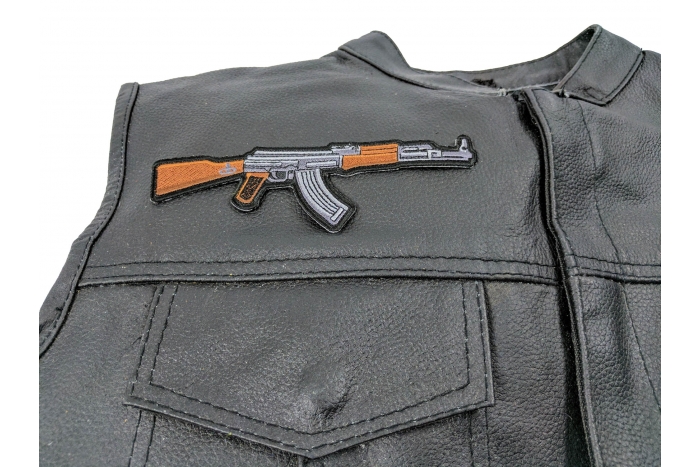 AK 47 Patch Right Assault Rifle Gun - 6x2 inch. Embroidered Iron on Patch shown on leather vest
