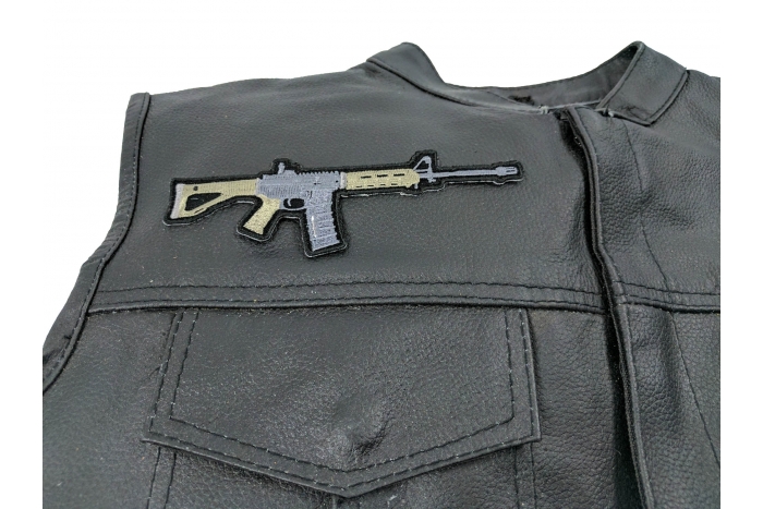AR 15 Assault Rifle Patch - 6x2 inch. Embroidered Iron on Patch shown on leather vest