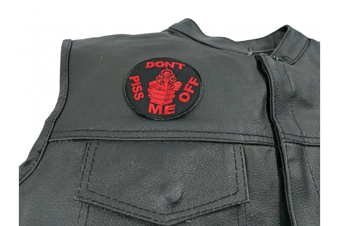 Don't Piss Me Off Gun Patch In Red - 3x3 inch. Embroidered Iron on Patch shown on leather vest
