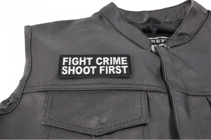 Fight Crime Shoot First Patch - 4x1.5 inch. Embroidered Iron on Patch shown on leather vest