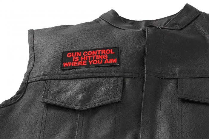 Gun Control Is Hitting Where You Aim Patch - 4x1.5 inch. Embroidered Iron on Patch shown on leather vest