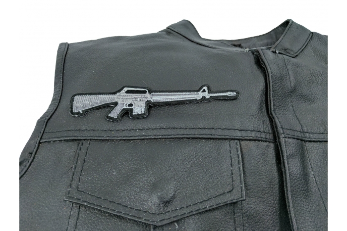 M16 Rifle Patch - 6x1.5 inch. Embroidered Iron on Patch shown on leather vest