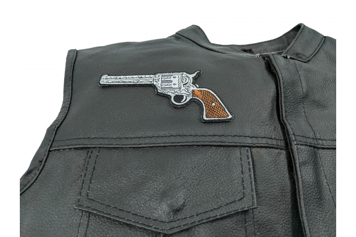 6 Shooter Pistol Patch Left Patch - 5x2.5 inch. Embroidered Iron on Patch shown on leather vest