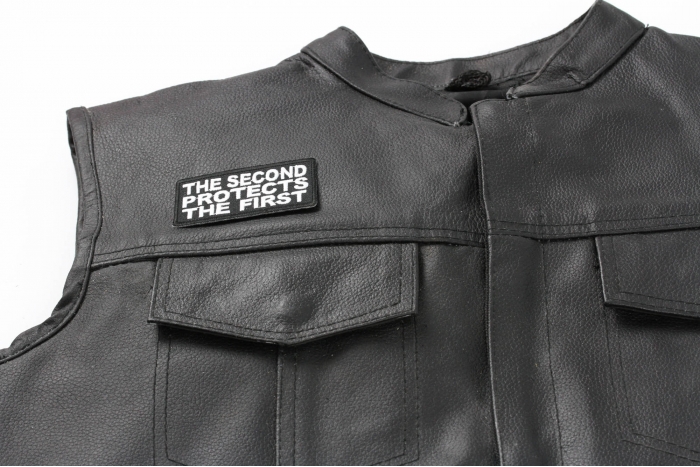 The Second Protects The First Patch - 3x1.5 inch. Embroidered Iron on Patch shown on leather vest
