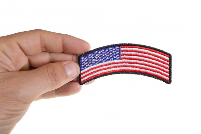 American Flag Rocker Patch shown on hand for size comparison