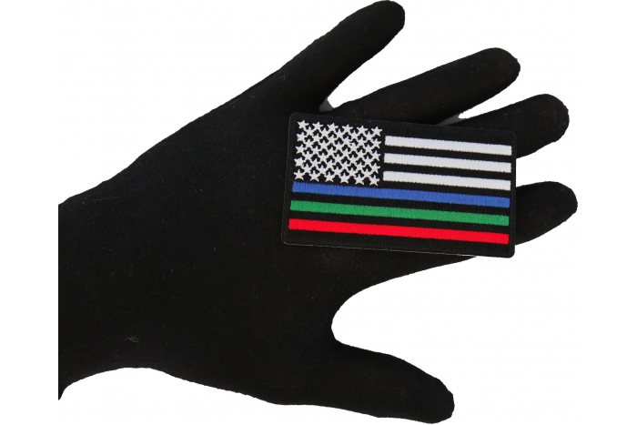 Blue Green and Red Striped American Flag Patch shown on hand for size comparison