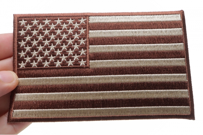Brown Subdued American Flag Patch shown on hand for size comparison