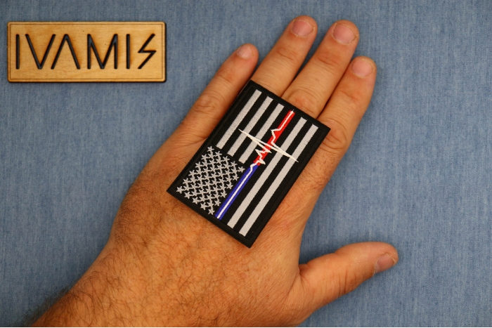 EMT American Flag Patch shown on hand for size comparison