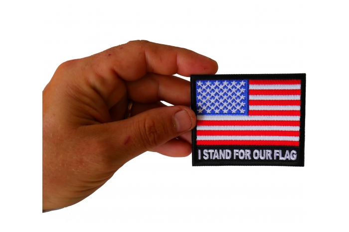 I Stand for Our Flag Patch shown on hand for size comparison