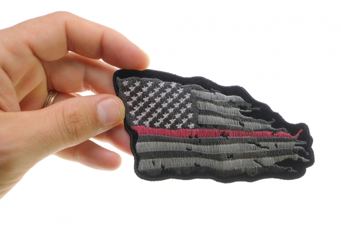 Pink Stripe Tattered American Flag Patch shown on hand for size comparison