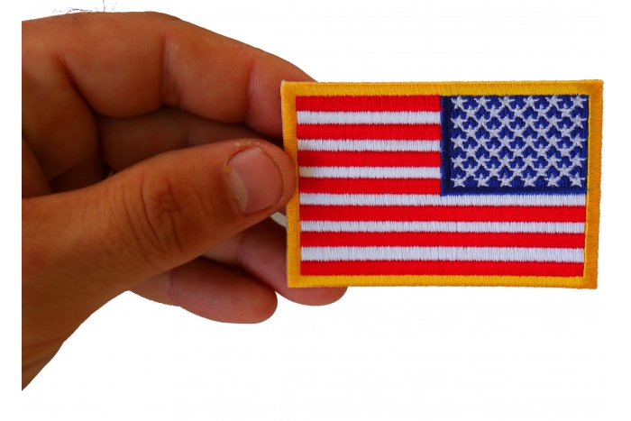 Reversed American Flag Patch shown on hand for size comparison
