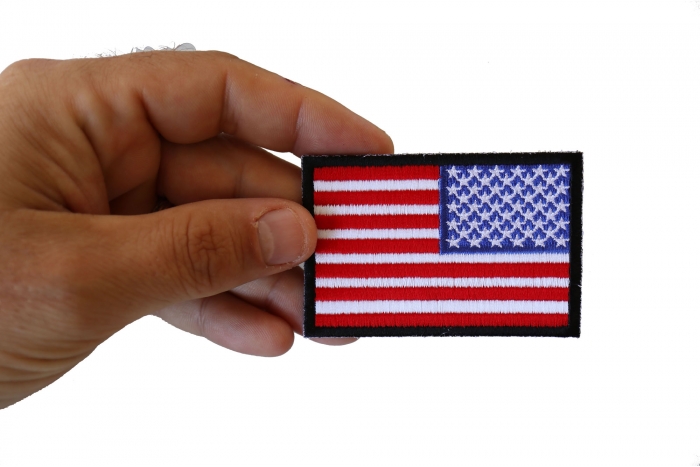Reversed American Flag with Black Borders Patch shown on hand for size comparison