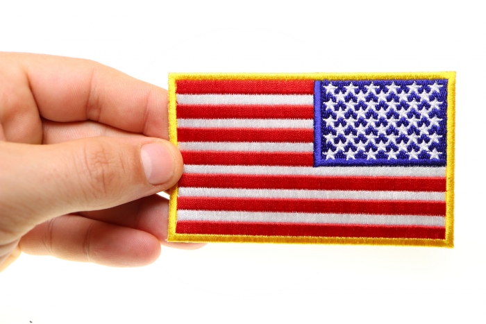 Reversed US Flag Patch 4 Inch Yellow Border shown on hand for size comparison