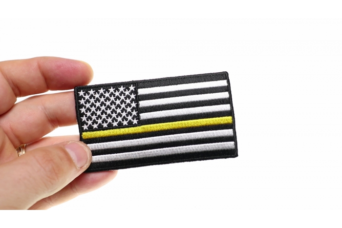 Subdued Yellow Stripe American Flag Patch shown on hand for size comparison