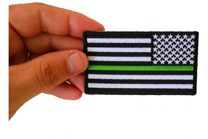 Thin Green Line American Flag Reversed Patch shown on hand for size comparison