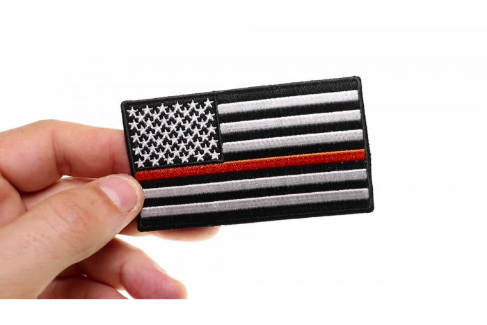 Thin Orange Line American Flag For Search & Rescue shown on hand for size comparison