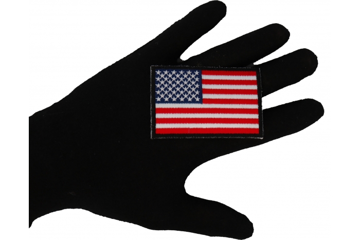 American Flag Patch with Black Borders shown on hand for size comparison