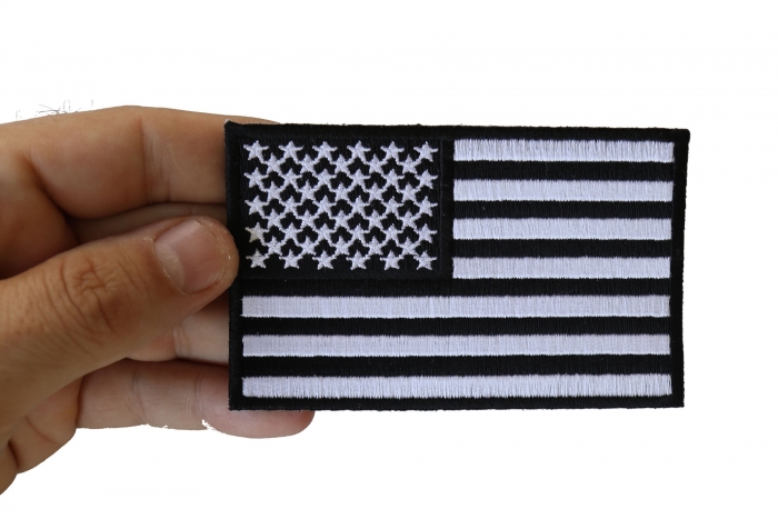 US Flag Black White Patch 4 Inch shown on hand for size comparison