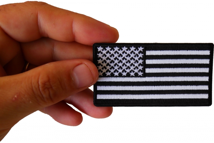US Flag Patch Black and White 3 Inch shown on hand for size comparison