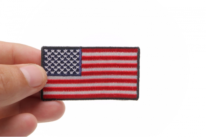 US Flag Patch Black Border 2.5 Inch shown on hand for size comparison