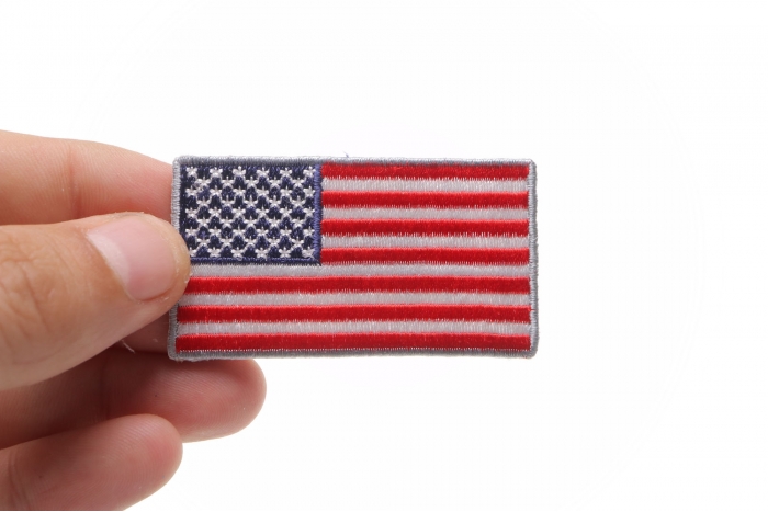 US Flag Patch Silver Border 2.5 Inch shown on hand for size comparison