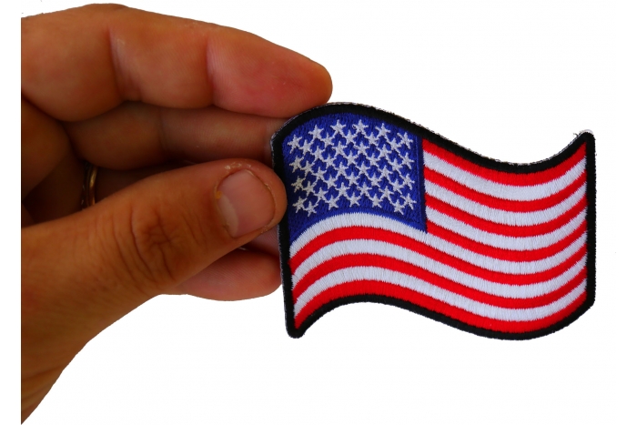 Waving US Flag Patch shown on hand for size comparison