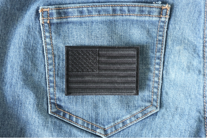 Black American Flag Patch shown on jeans