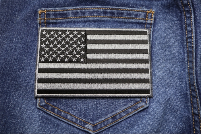 Black and Gray American Flag Patch shown on jeans